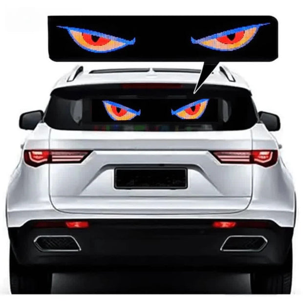 StareGang LED animated car eyes display glowing on vehicle glass with fierce orange and blue eyes
